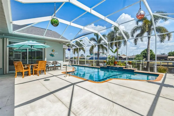 Screened Pool Oasis with Canal Views