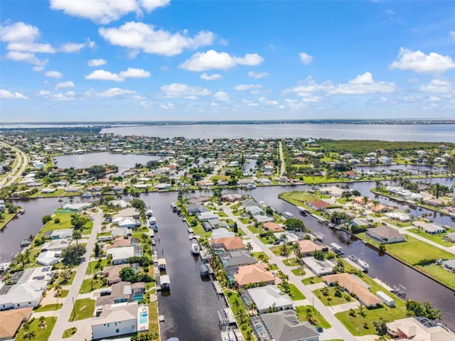 Aerial View of Home, Pool &amp; Sailboat Canal