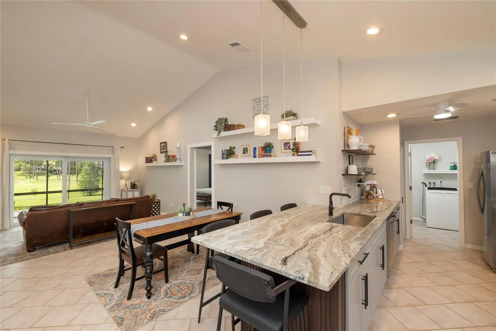 Great room with cathedral ceilings all focus on park views.