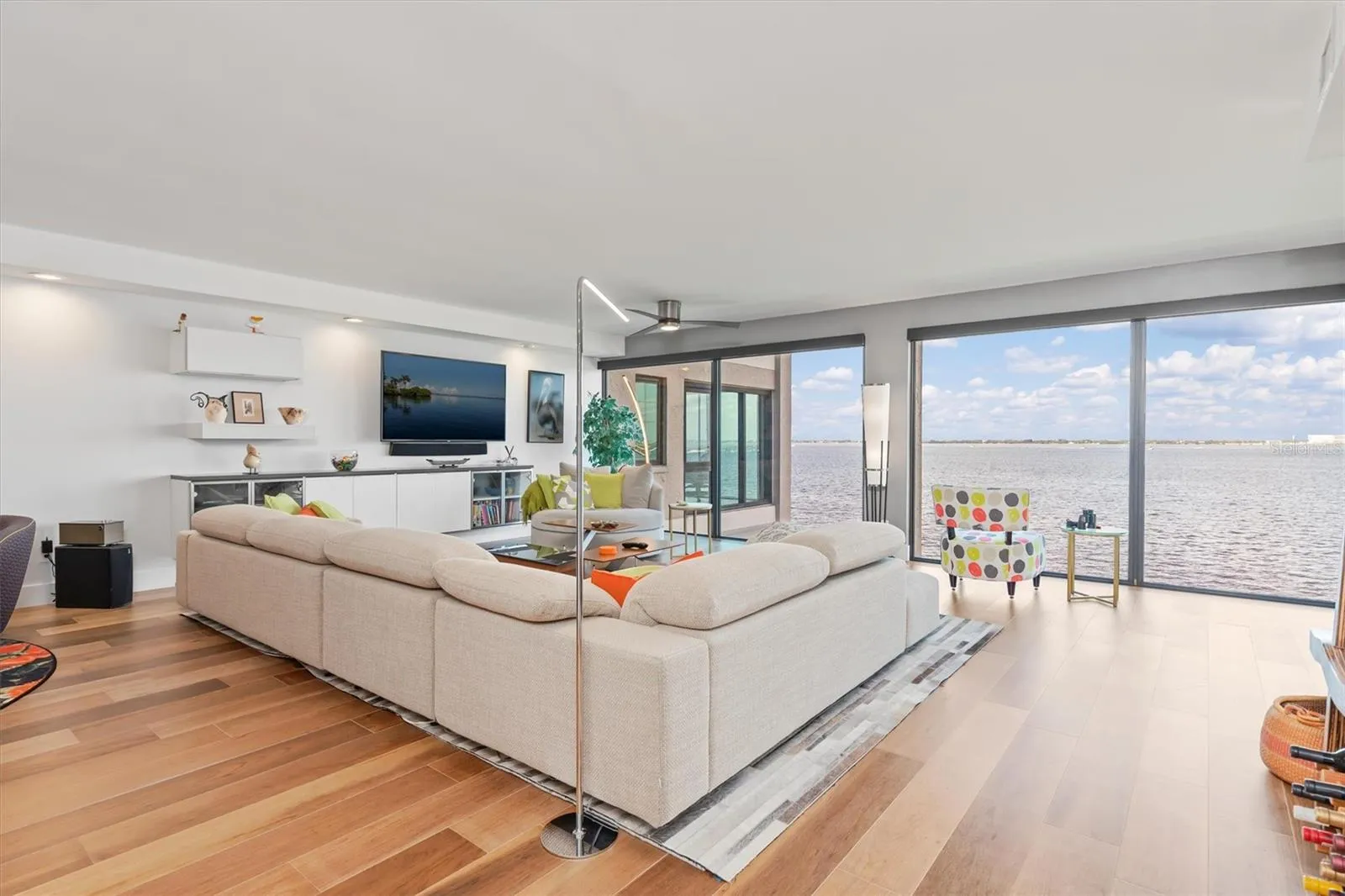 Great room with hurricane rated windows, remote operated shades
