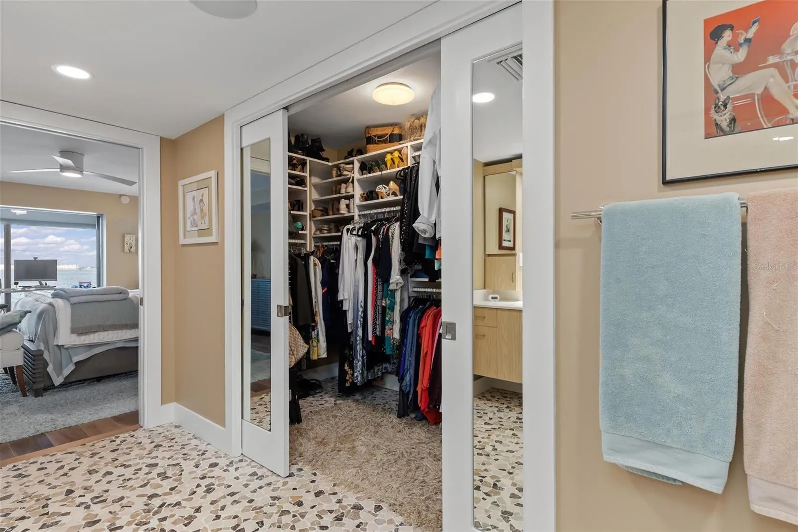 Sliding, mirrored pocket doors to walk in closet