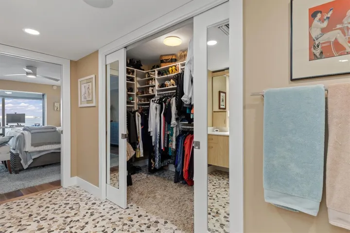 Sliding, mirrored pocket doors to walk in closet