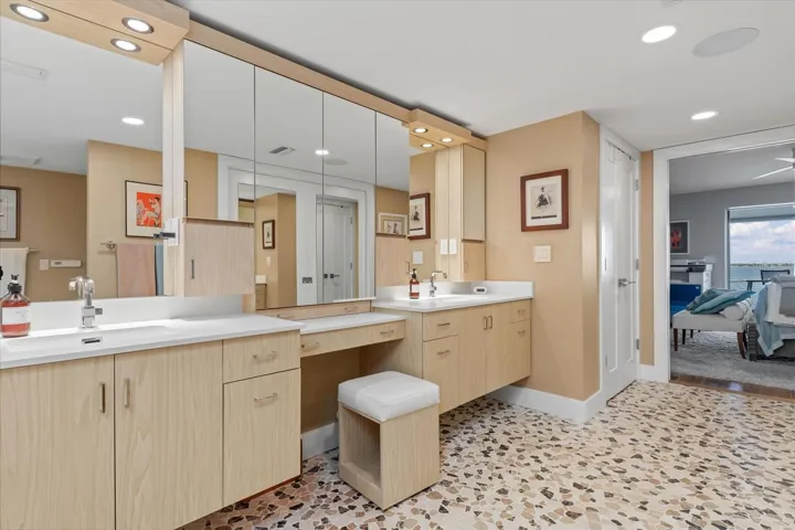 Walk in closet across from vanities