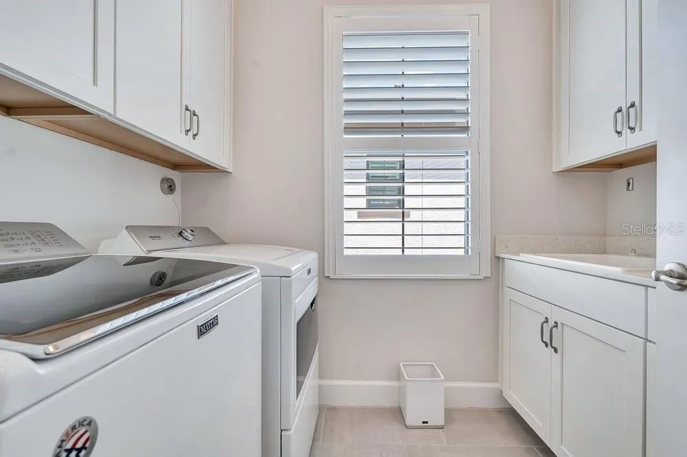 Laundry room with sink &amp; storage cabinets