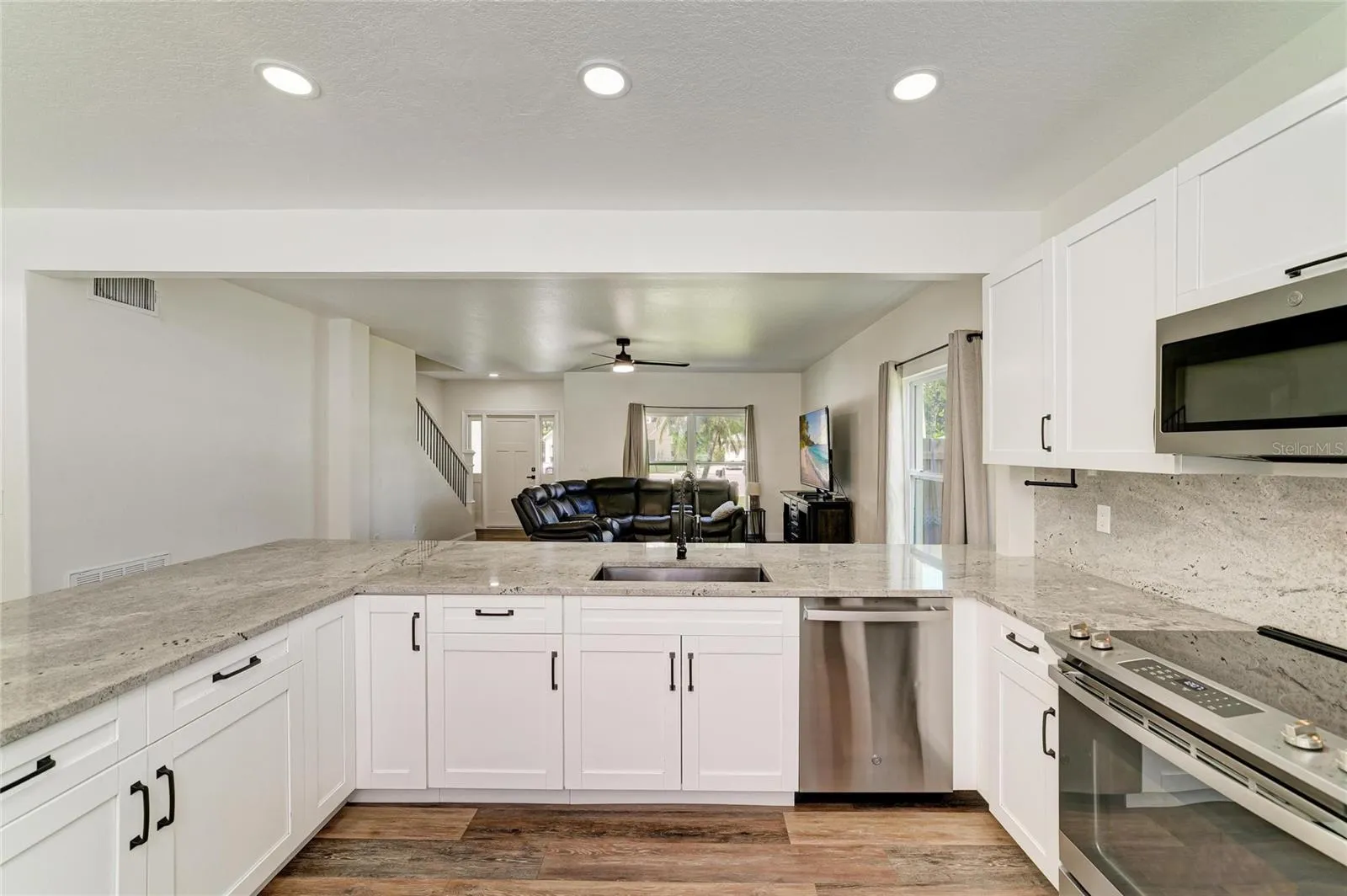 Soft close cabinetry, stainless steel appliances, and granite counters.