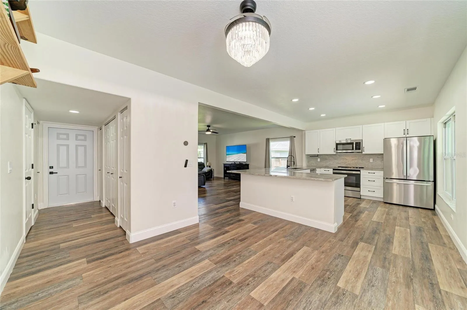 Indoor laundry and half bath located in first floor hallway.
