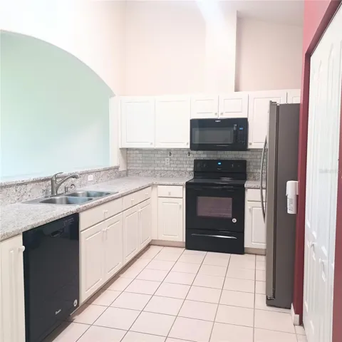 Kitchen pantry on right side of frig