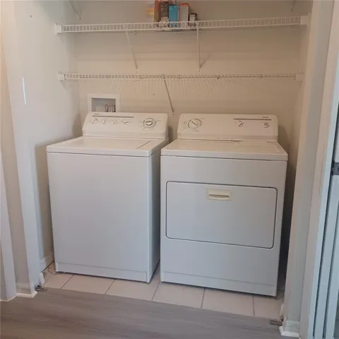 Laundry closet in the condo, NOT in garage.