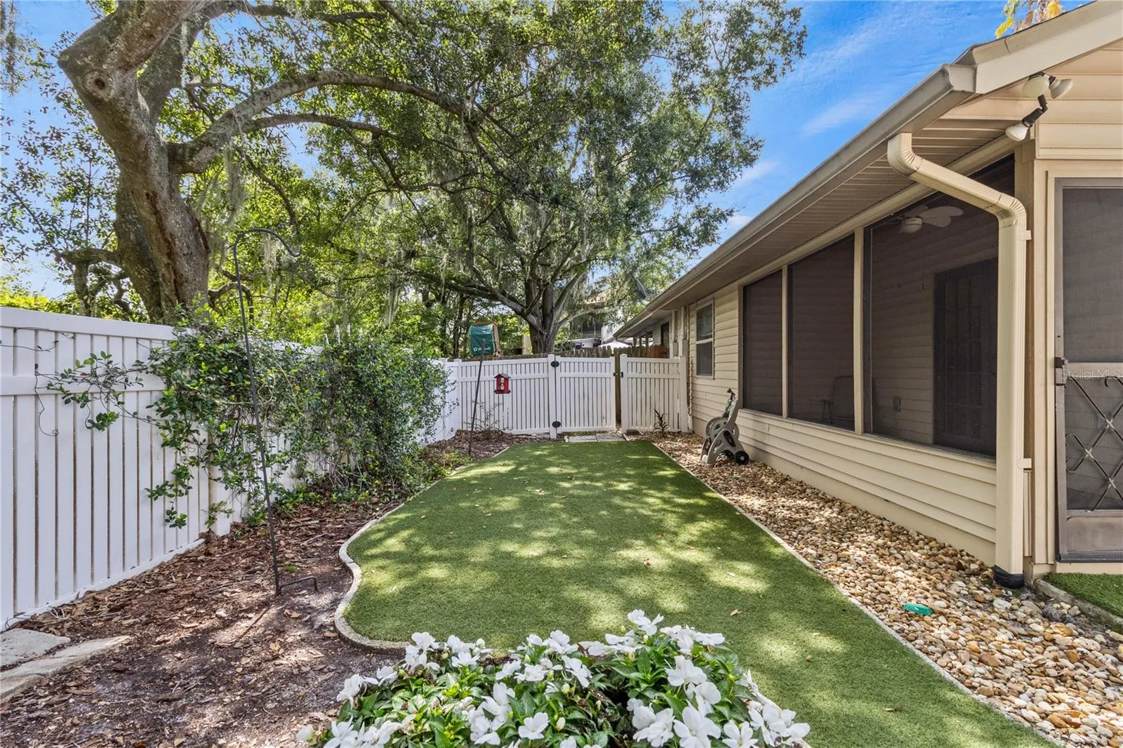 view of back porch and fenced in yard