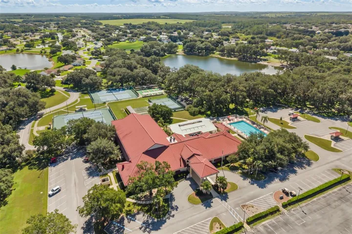 Clubhouse with outdoor pool, tennis, pickle ball and bocce ball courts; lakes for catch &amp; release fishing
