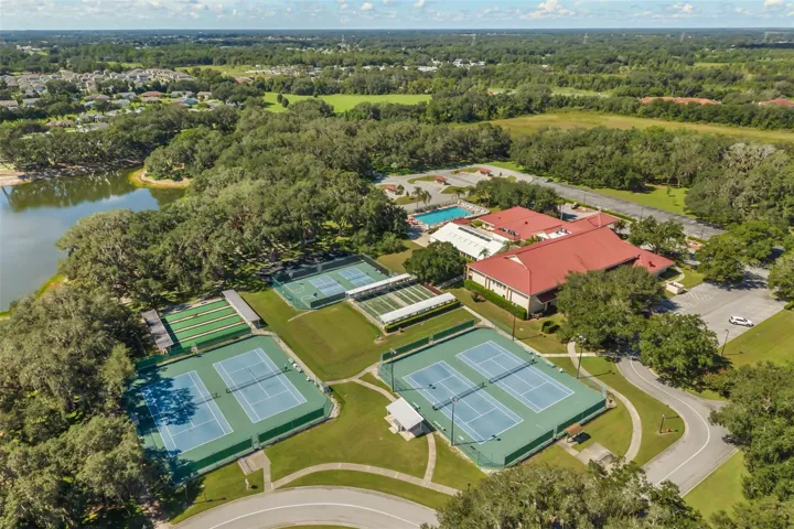 Clubhouse with outdoor pool, tennis, pickle ball and bocce ball courts, shuffleboard