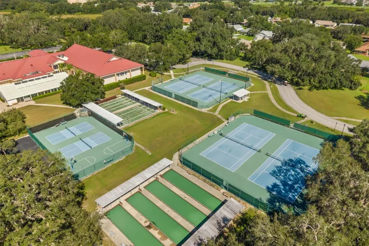 Clubhouse with tennis, pickle ball and bocce ball courts, shuffleboard