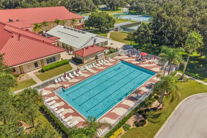 Clubhouse with outdoor pool, tennis, pickle ball and bocce ball courts