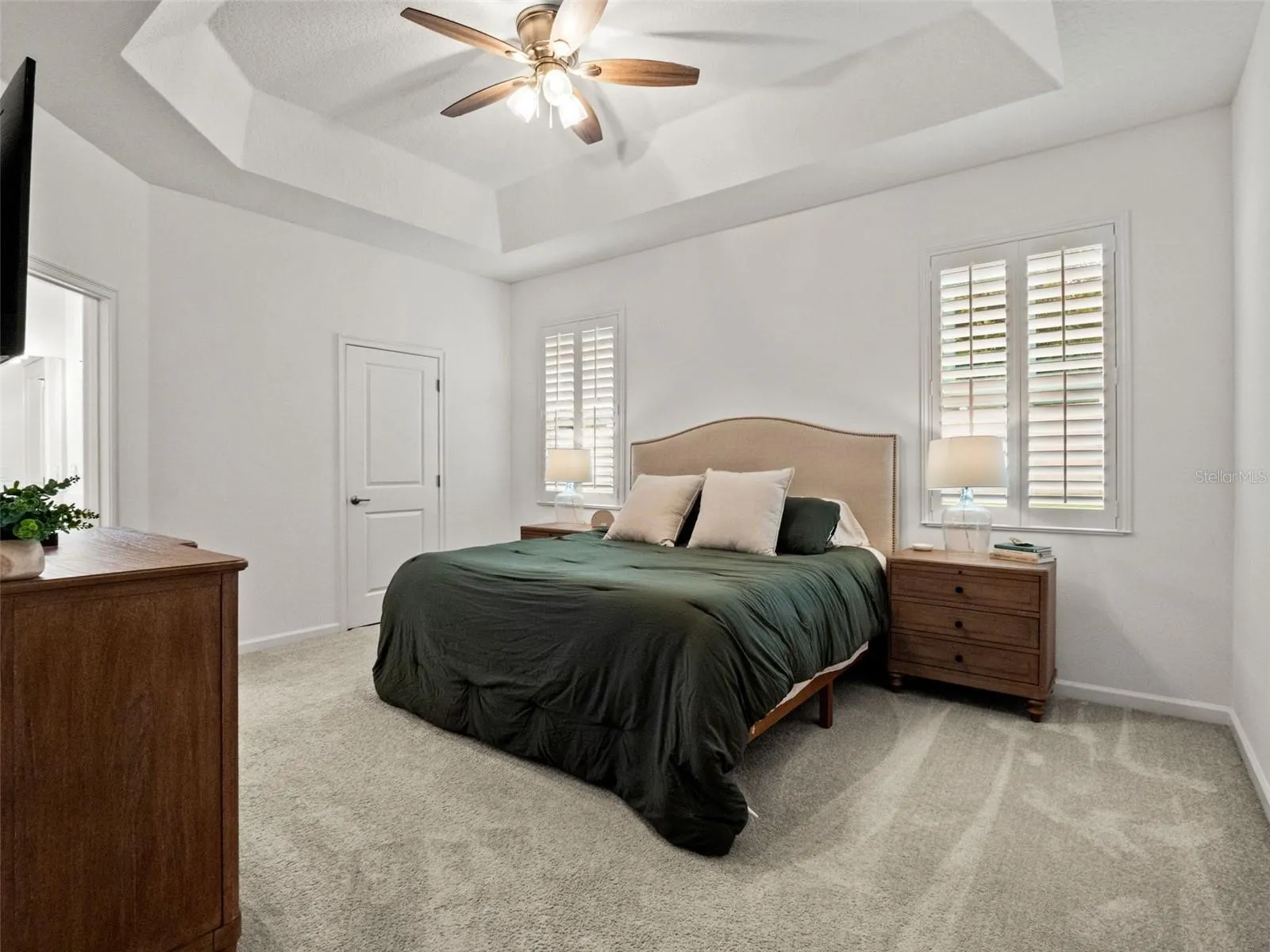 Large primary suite with tray ceiling.