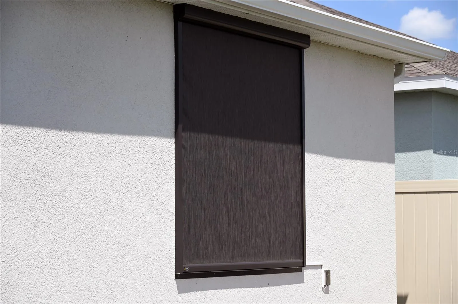 Motorized screen covering master bedroom window