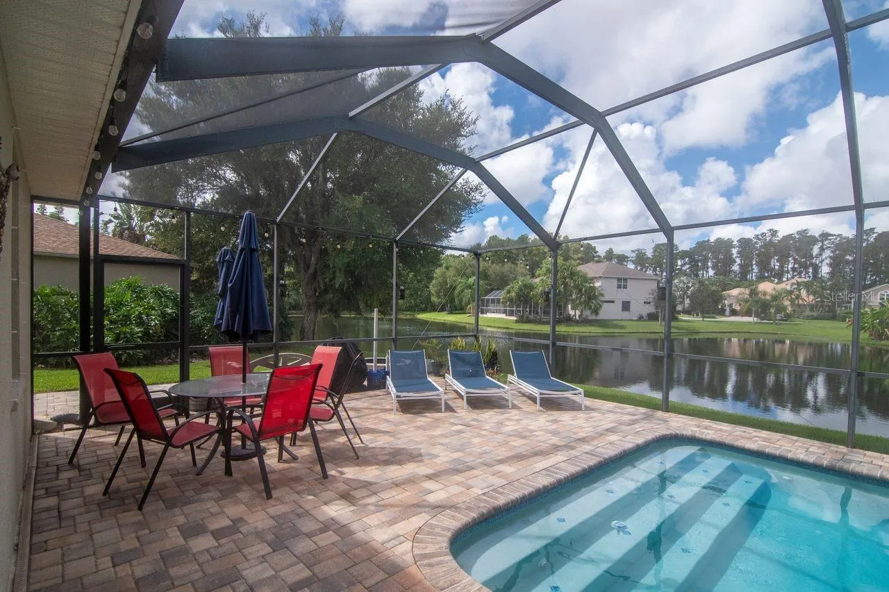 Private Retreat - Extended pavered lanai beyond the screen enclosure. Offering plenty of space for outdoor entertaining.