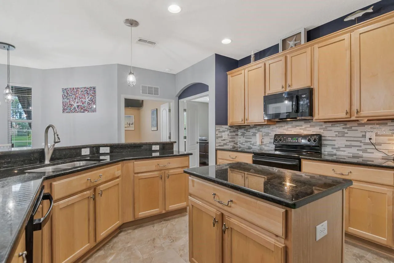 Updated Kitchen featuring a Double Island, granite countertops, and huge breakfast bar