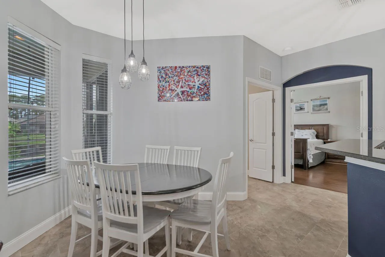 Eat in kitchen space with lots of natural light and pool and pond views.