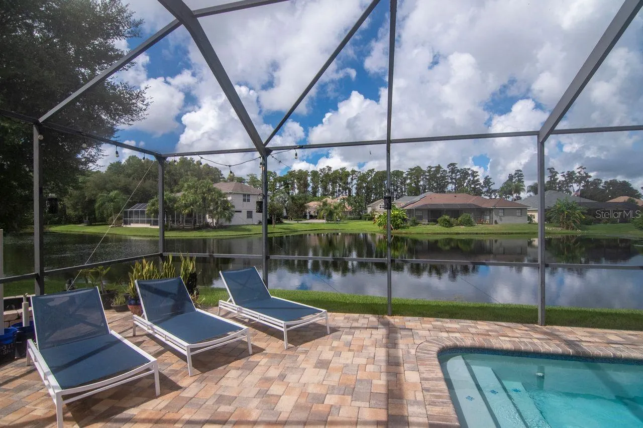 Private Retreat - Extended pavered lanai beyond the screen enclosure. Offering plenty of space for outdoor entertaining.