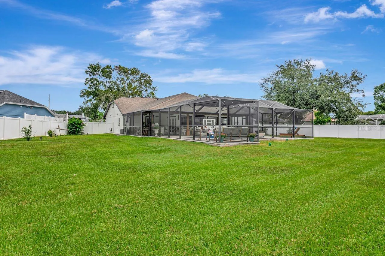 View of Back of Home, Side Yards, Fully Fenced, Pool and Pool Cage