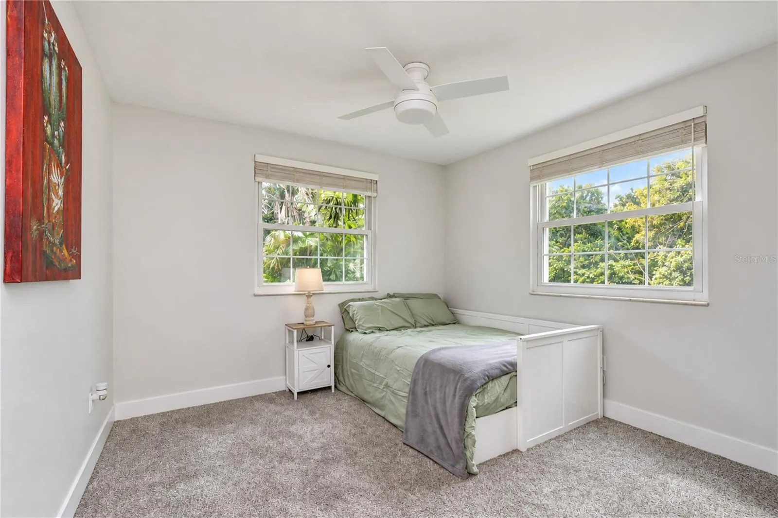 Comfortable secondary bedroom with easy access to the remodeled guest bath