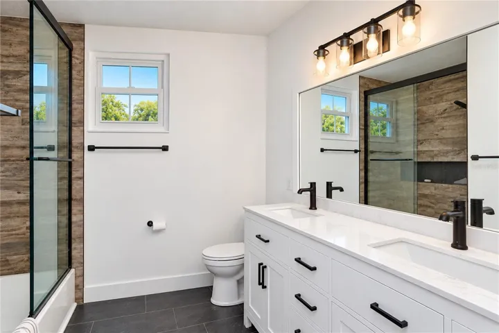Fully remodeled bathroom features a double vanity