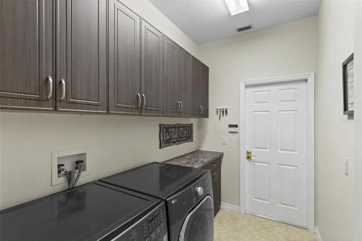 Interior Laundry w. Cabinets and Counter Space