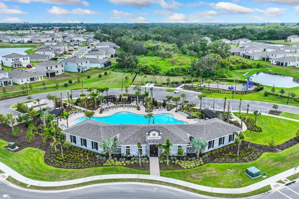 AERIAL VIEW OF CLUBHOUSE, POOL, PLAYGROUND AND DOGPARK