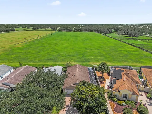 Drone view showcasing the home and the adjacent polo field.