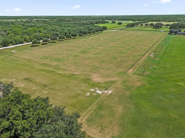 Drone of the polo field behind