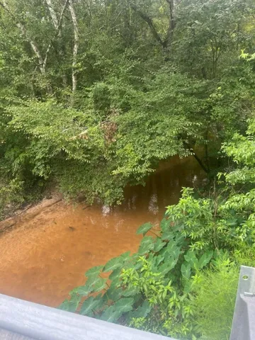 Rocky Comfort Creek flowing under Old Federal Road