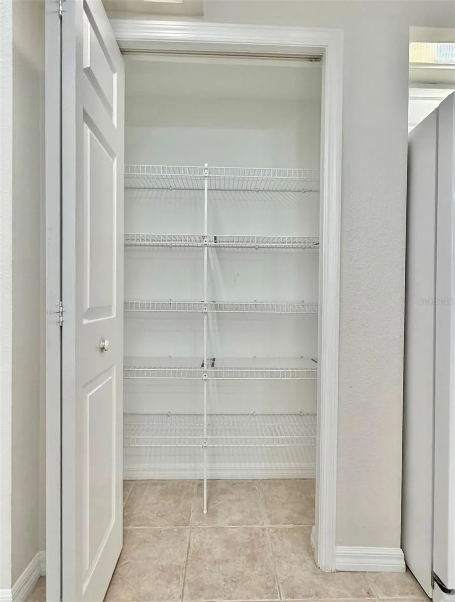 The pantry has ample room for all your needs.