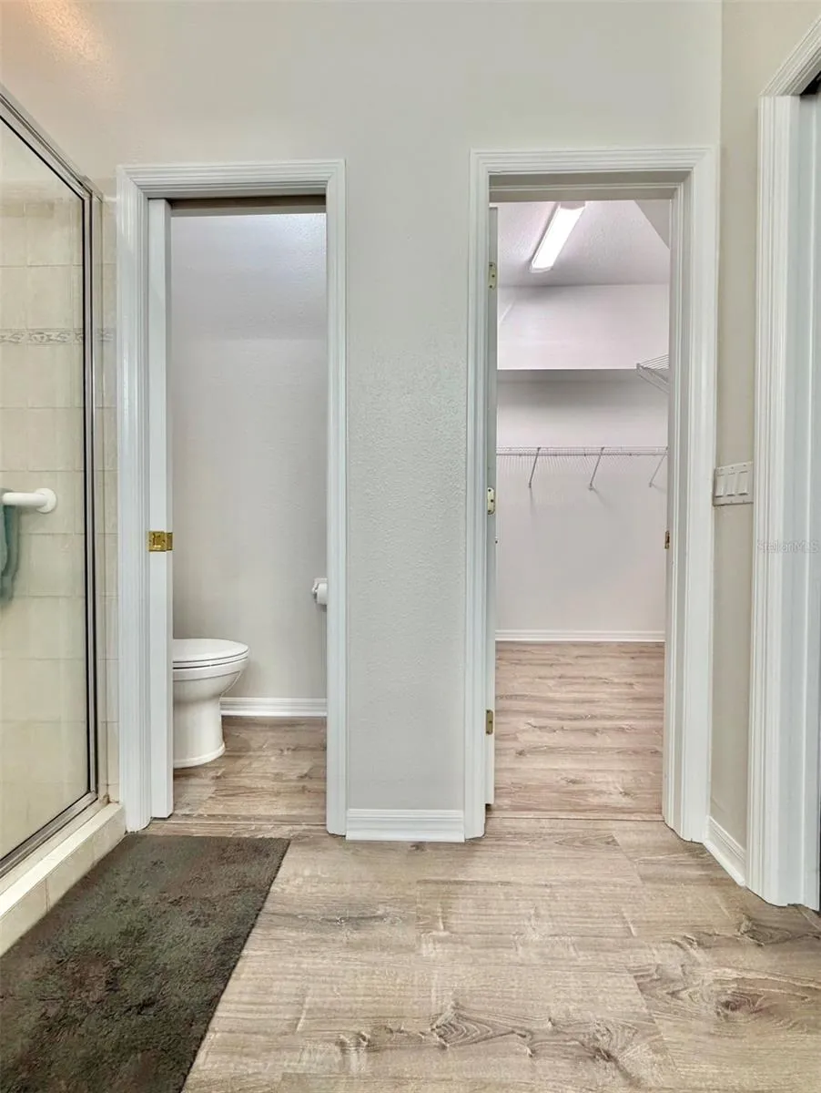 The water closet is on the left, and the walk-in closet is to the right.
