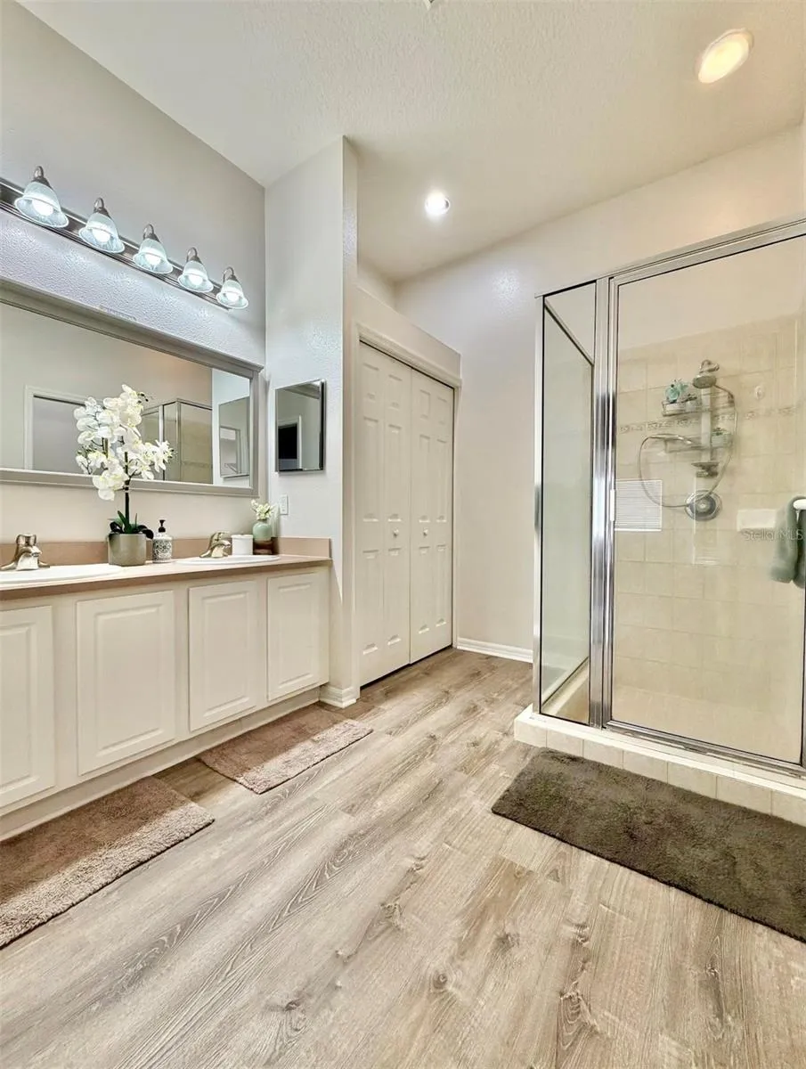 The Primary Ensuite is so luxurious and features a double sink, updated lighting, a very large linen closet, a walk-in shower, a private water closet, and a huge walk-in closet!!