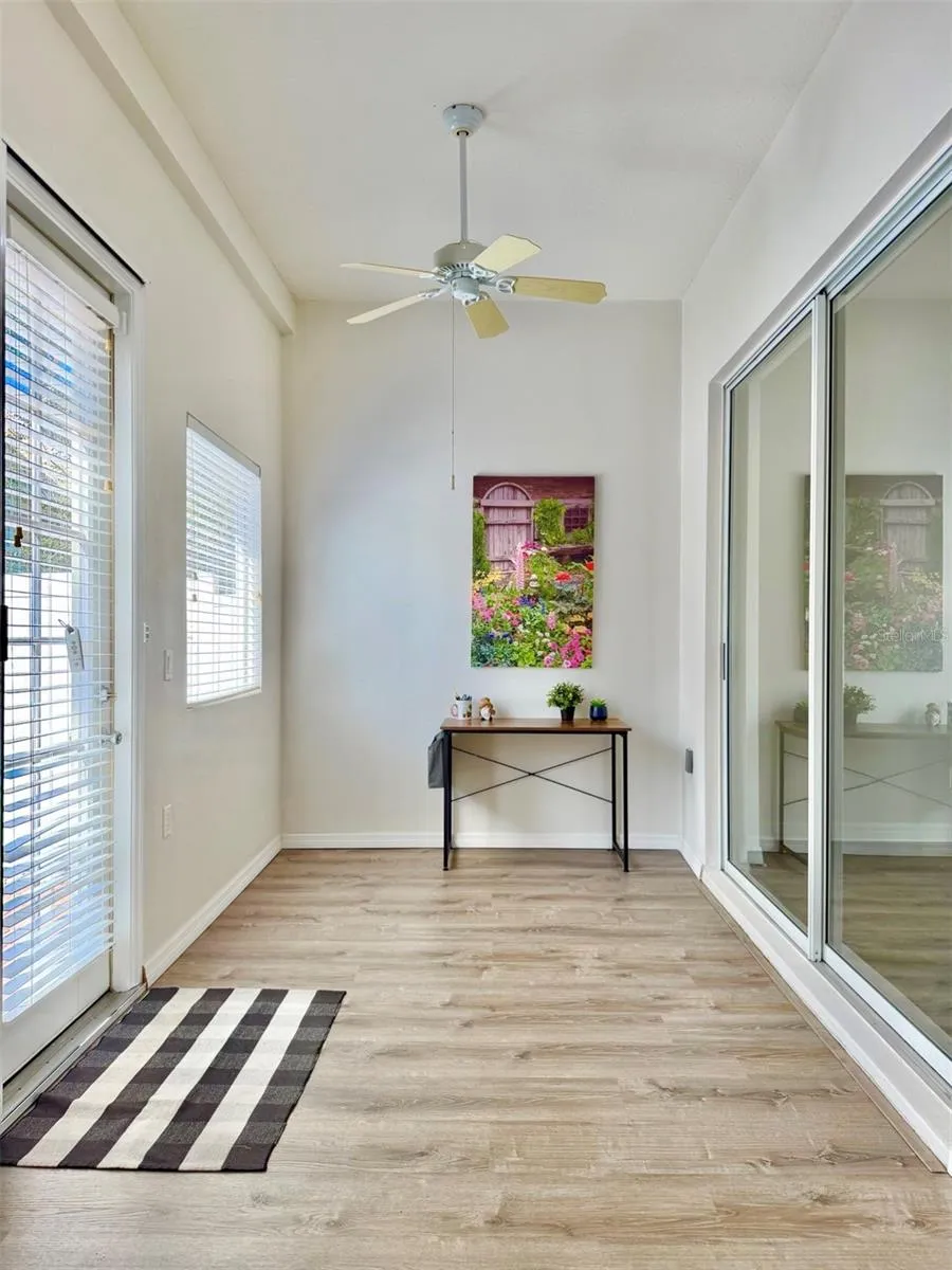The closed-in back sunroom can be used as an office or a sitting room, or even the grandkids play space!