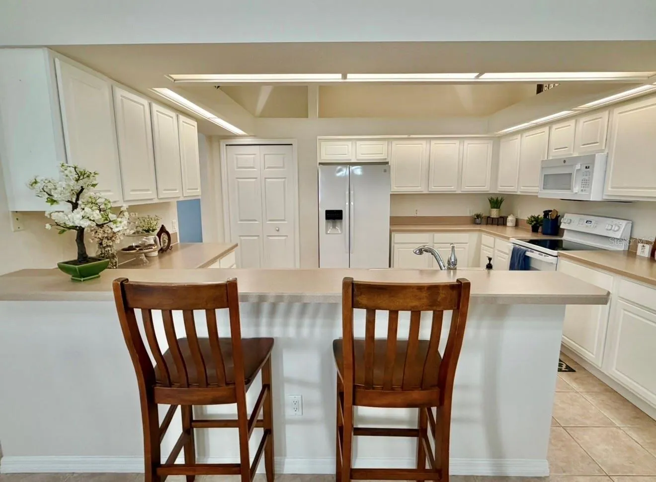A view of the kitchen from the dining room.