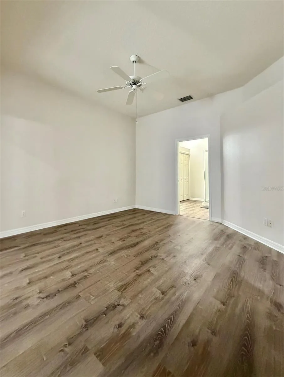 The Primary Bedroom is really spacious and the ensuite is seen through the open door.