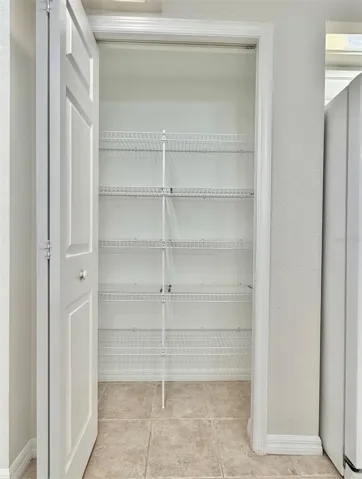 The pantry has ample room for all your needs.