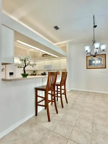 The breakfast bar can easily fit four barstools.