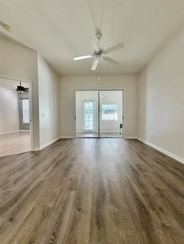 The Primary Bedroom is really spacious and has a sliding glass door to the closed-in patio, which can be easy access to an office space.