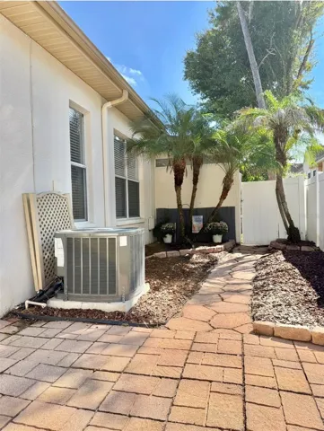A very private, fenced-in patio with space for a garden.