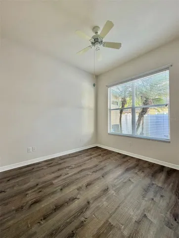 Bedroom 3 overlooks the back patio and features a ceiling fan and an extra-wide closet.