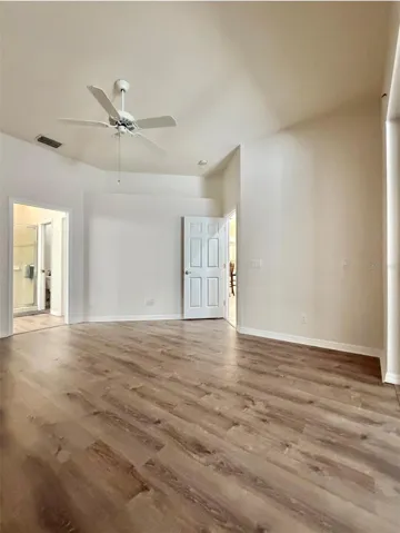 The Primary Bedroom is really spacious and has a sliding glass door to the closed-in patio, which can be easy access to an office space.
