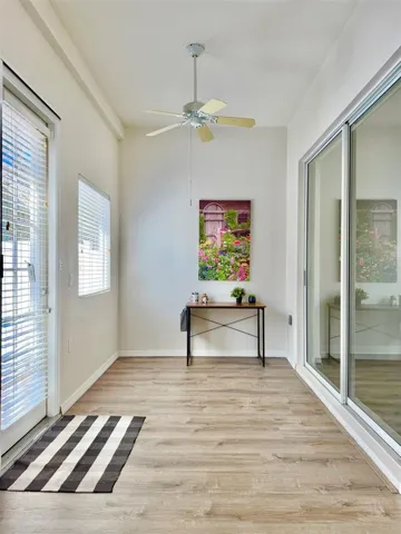 The closed-in back sunroom can be used as an office or a sitting room, or even the grandkids play space!