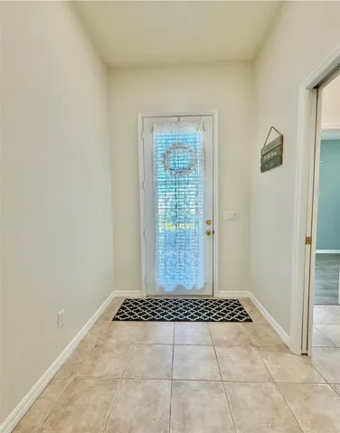 Beautiful entryway, front door has a window. It's nice to see who's at the door and also have natural light shine in.