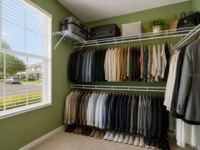 Primary Bedroom Closet Vertially Staged