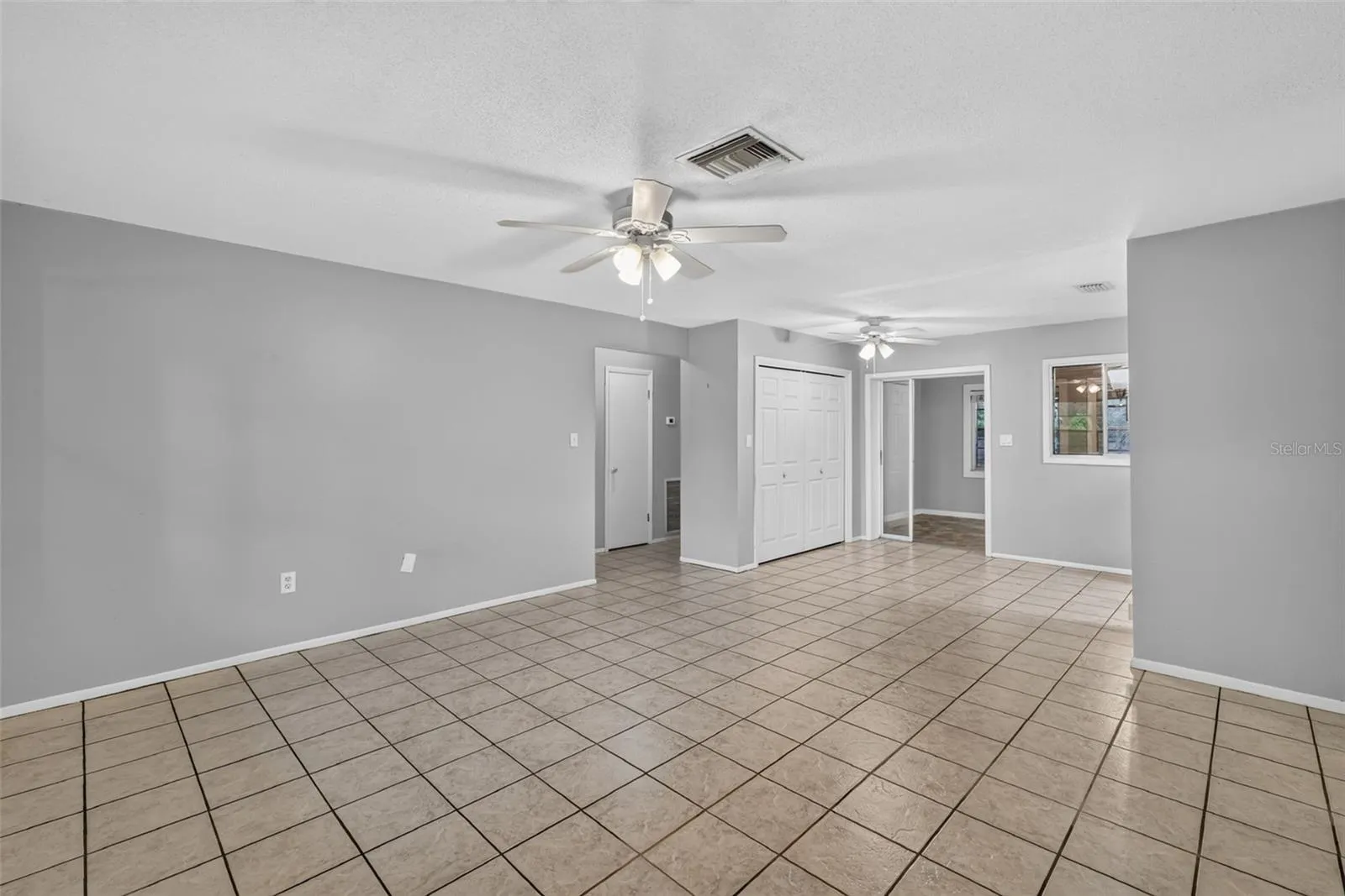 Spacious Living Room Ready for your Personal Style and Furnishings