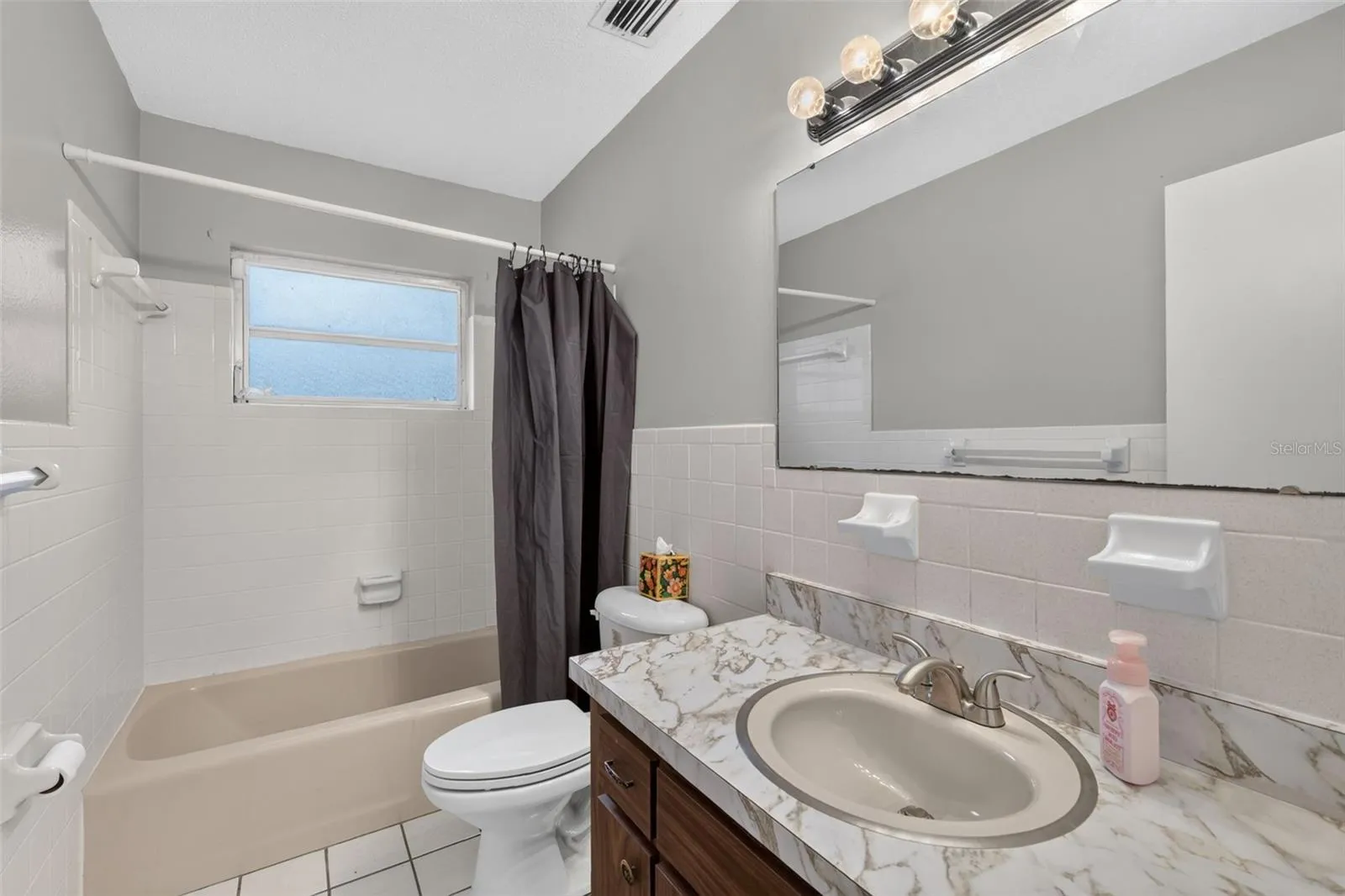 Full Guest Bathroom Conveniently Located Next to the Second Bedroom
