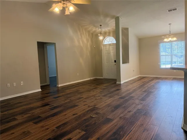 View from dining nook to living room area &amp; front door