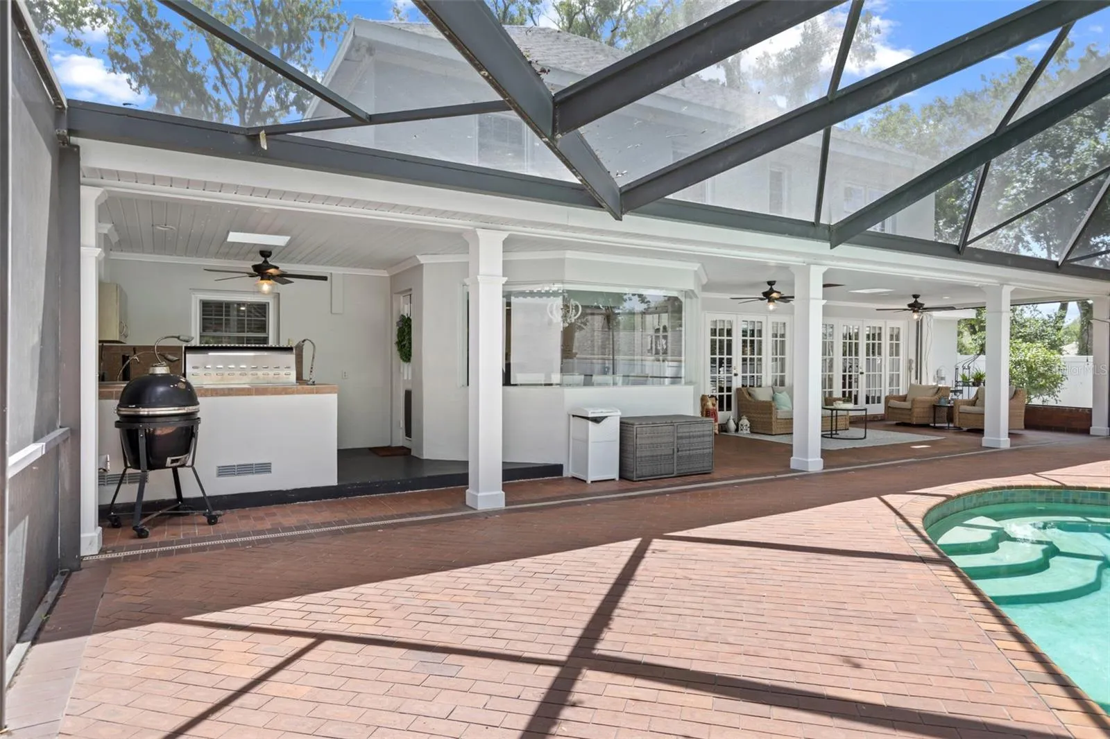 The enormous screened-in lanai with a large covered area is perfect for large gatherings.